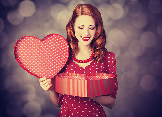 http://www.dreamstime.com/royalty-free-stock-images-redhead-girl-gift-valentines-day-photo-bokeh-background-image35410239